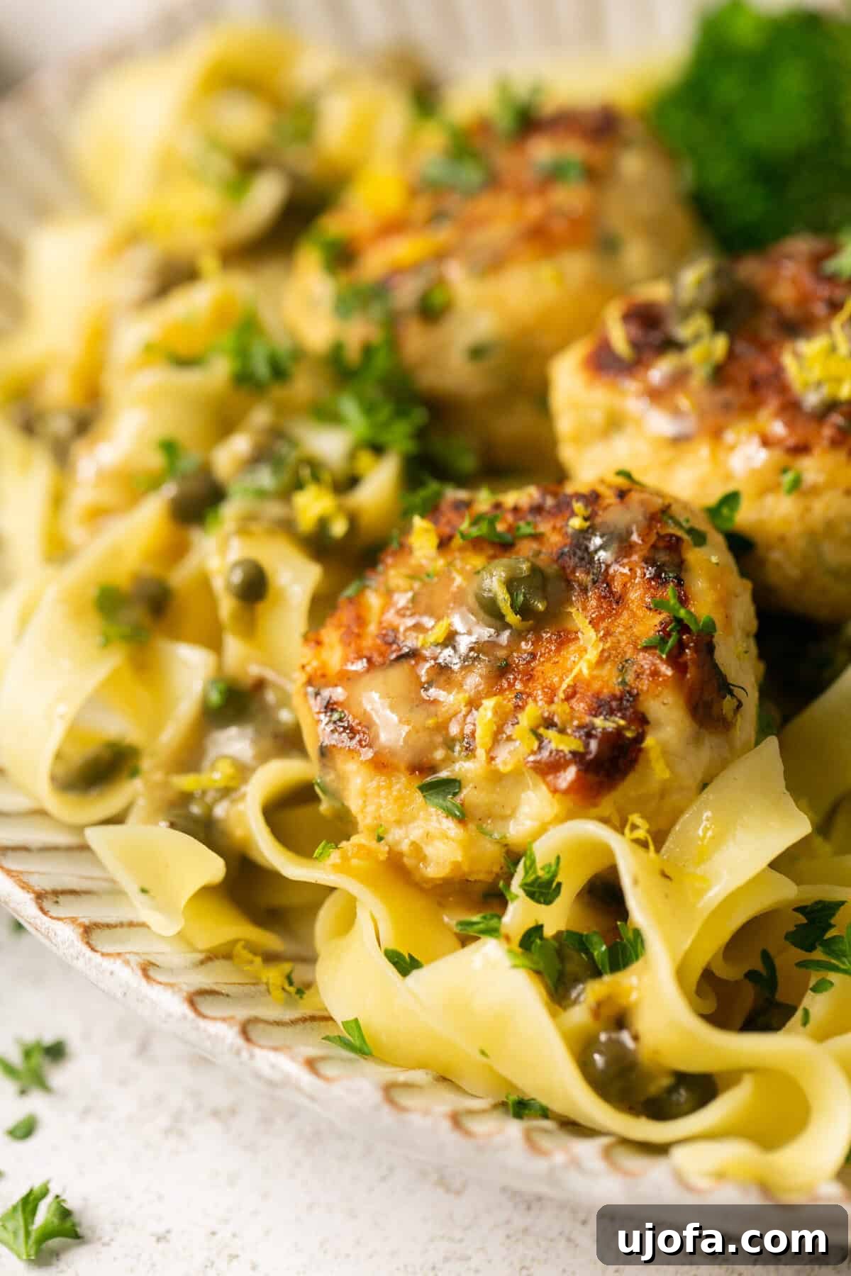 Zesty Gluten-Free Chicken Piccata Meatballs 6 close up of chicken meatballs with pasta