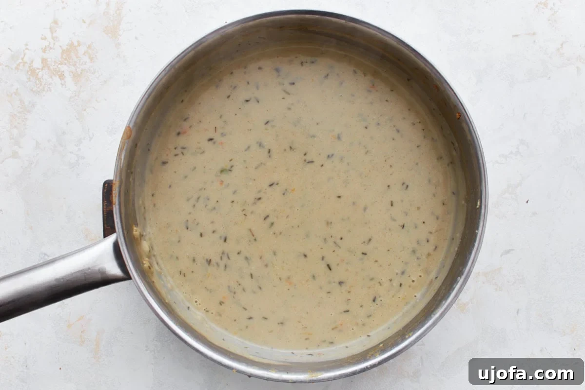 The Ultimate Gluten-Free Chicken Pot Pie 11 gluten-free pot pie cream mixture in a stainless steel pot