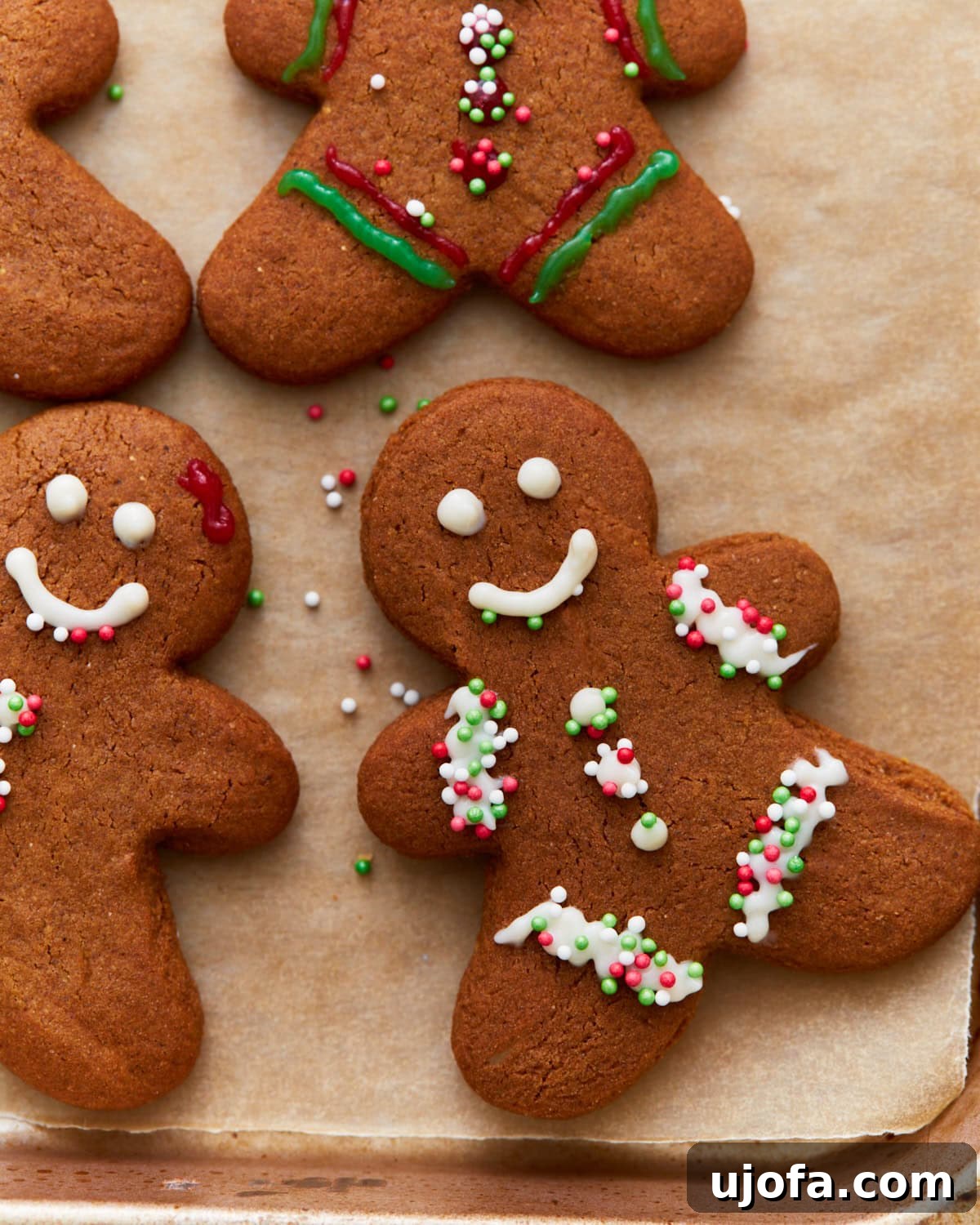 Guilt-Free Gingerbread Bliss 5 A delightful overhead view of a batch of freshly baked, plain gluten-free gingerbread cookies, showcasing their golden-brown edges and inviting texture, ready for decorating or enjoying as is.