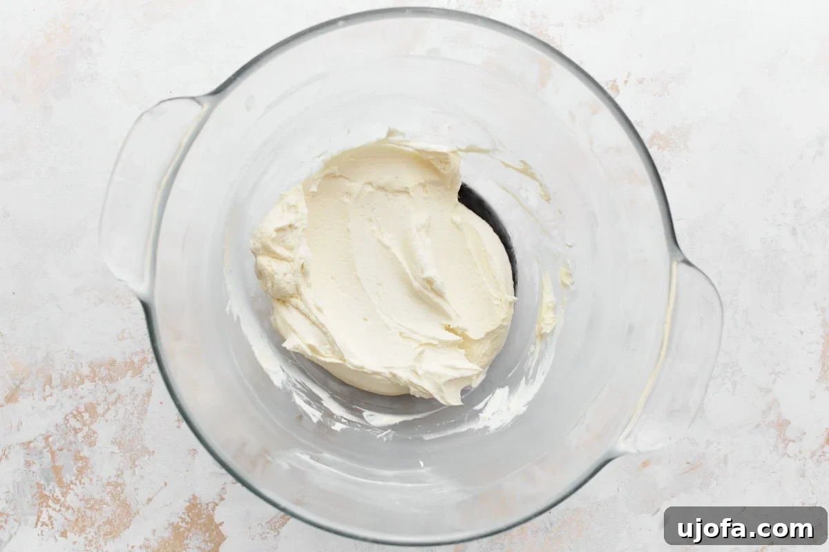Cream cheese and butter creamed together in a glass bowl