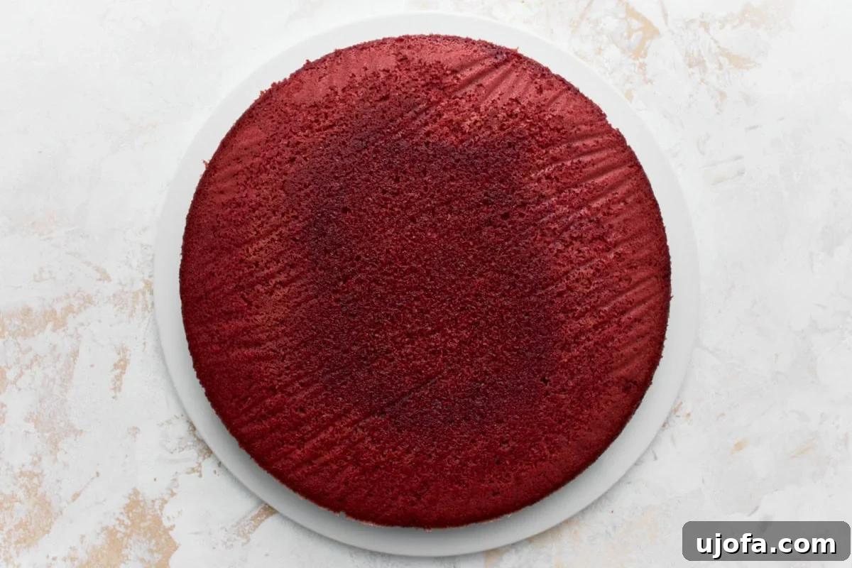 Baked gluten-free re velvet cake on a white cake plate