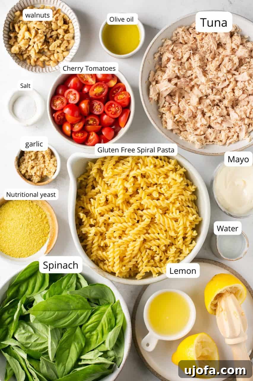 Effortless Gluten-Free Tuna Pesto Pasta 3 nesting bowls filled and labeled with recipe ingredients