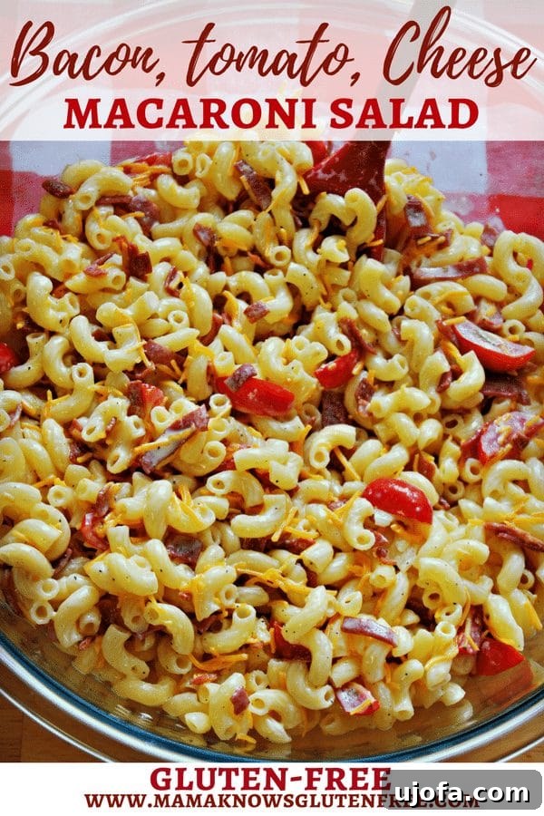 Creamy Gluten-Free Bacon, Tomato, and Cheese Macaroni Salad 4 Various ingredients for gluten-free bacon, tomato, and cheese macaroni salad, including cooked pasta, chopped bacon, quartered tomatoes, and shredded cheese, waiting to be mixed.