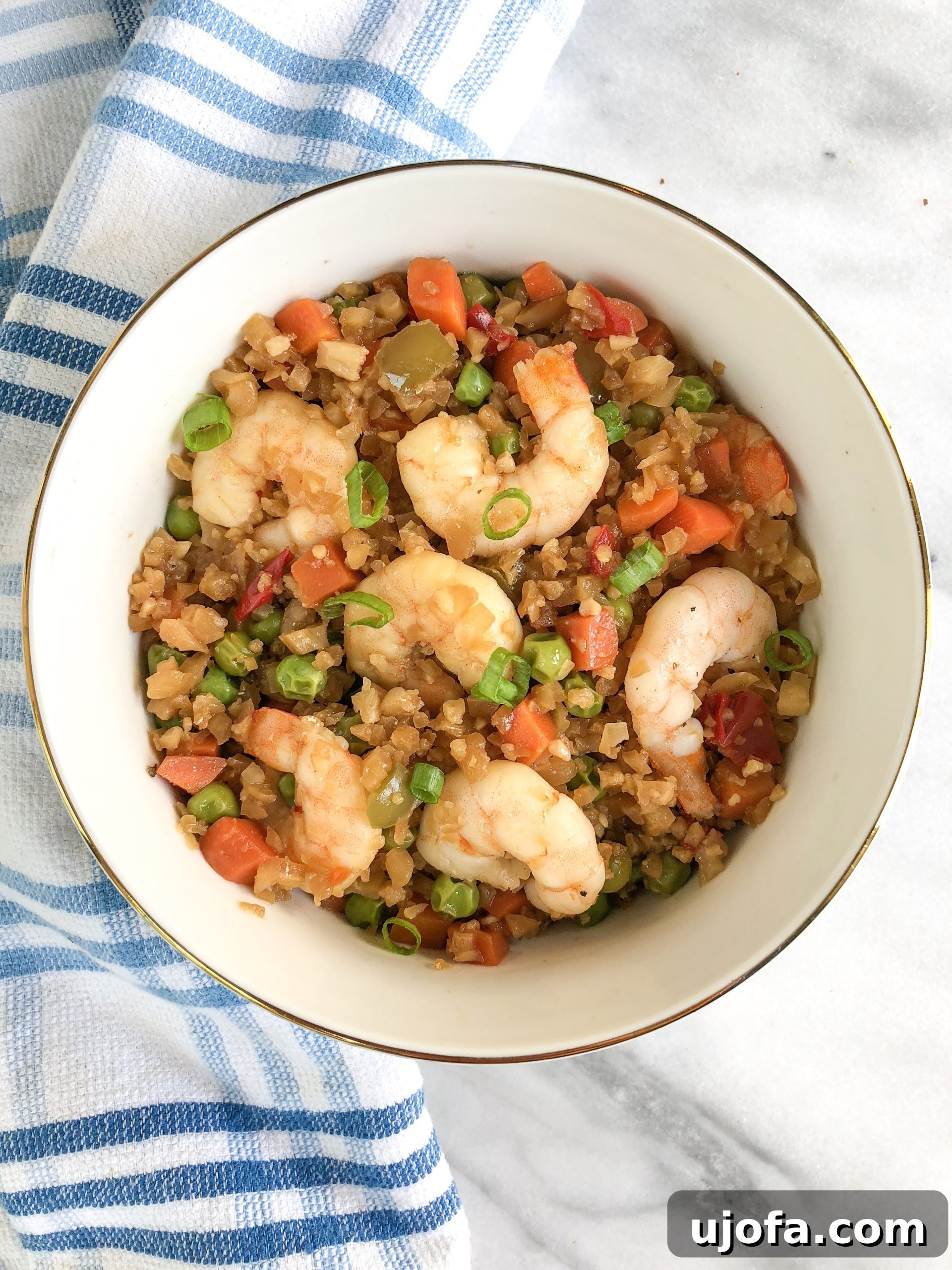 Savory Paleo Shrimp Cauliflower Fried Rice 4 Finished Paleo Shrimp Fried Rice in a skillet, ready to be served.