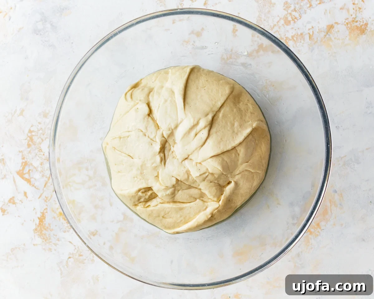 Artisan Gluten-Free Focaccia 8 stiff gluten-free focaccia dough in a glass bowl.