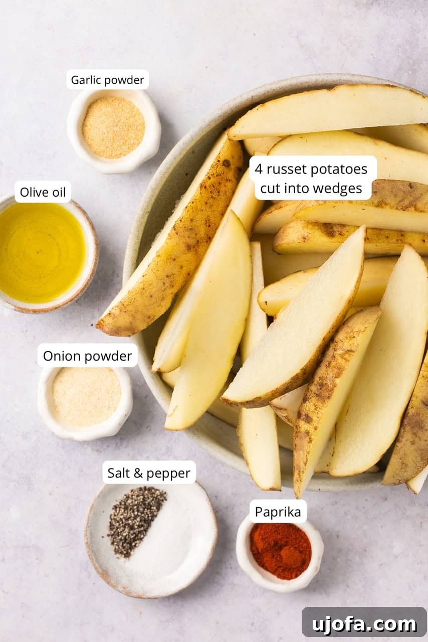 Golden Air-Fried Potato Wedges 3 ingredients for air fryer potato wedges labeled including Russet potaotes, seasonings, and oil
