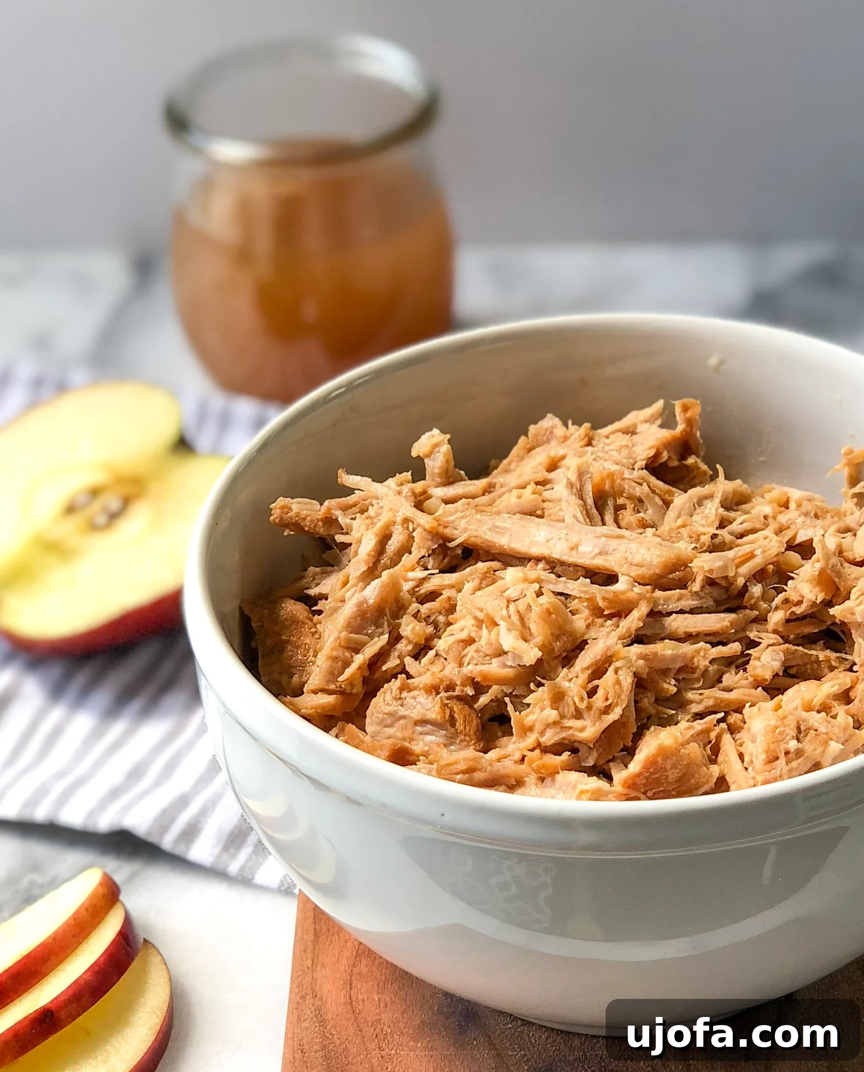 Tender Instant Pot Cider Pulled Pork on a serving plate