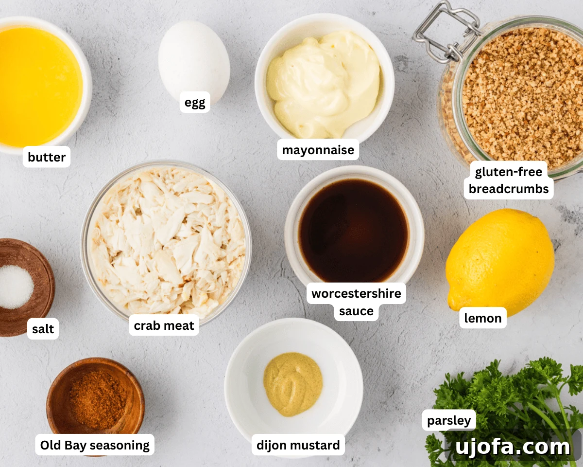 A flat lay of all the fresh ingredients required for making gluten-free crab cakes, neatly arranged on a wooden board.