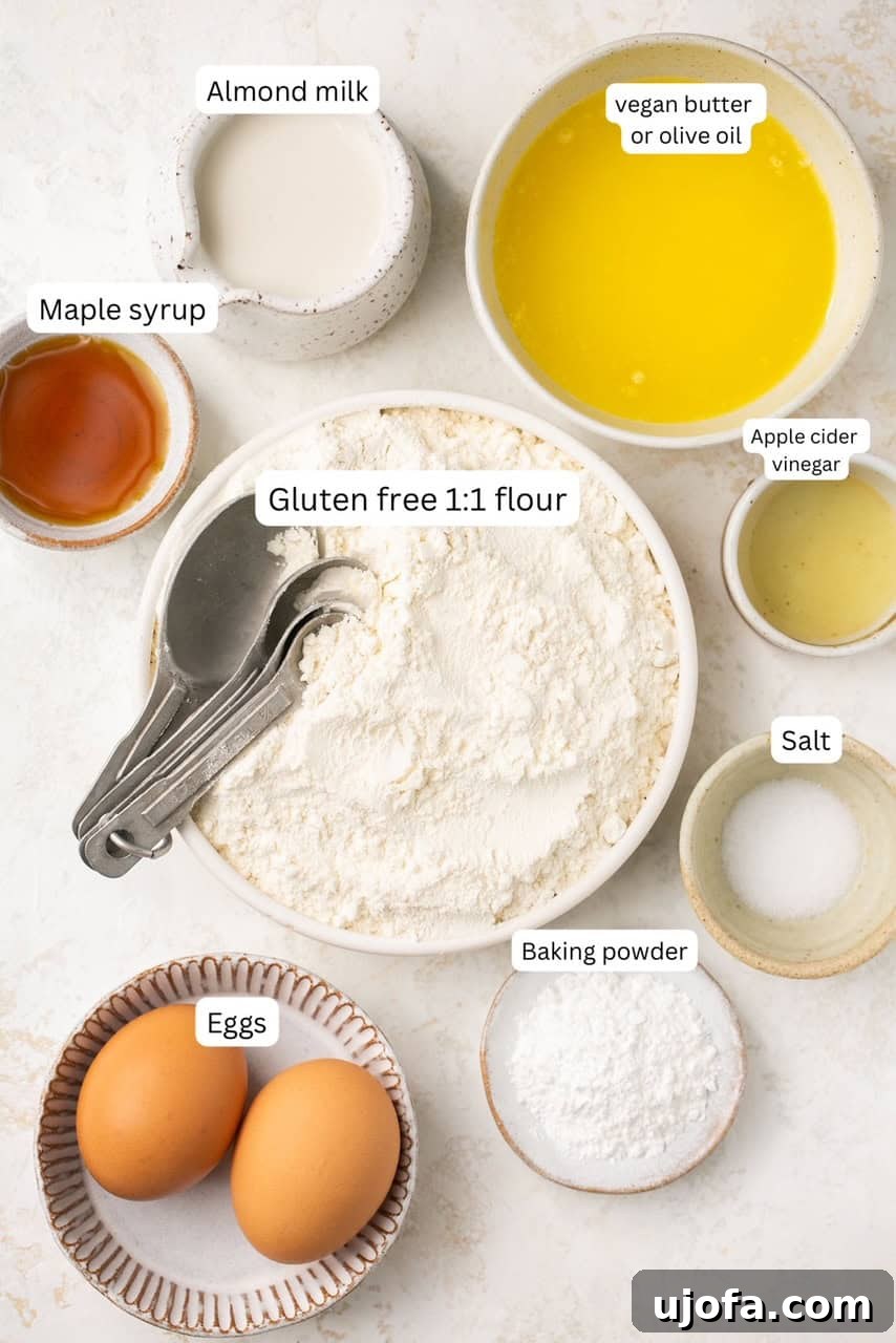 Arrangement of individual ingredients for dairy-free gluten-free biscuits displayed in small white bowls on a rustic wooden backdrop, highlighting their freshness and simplicity.