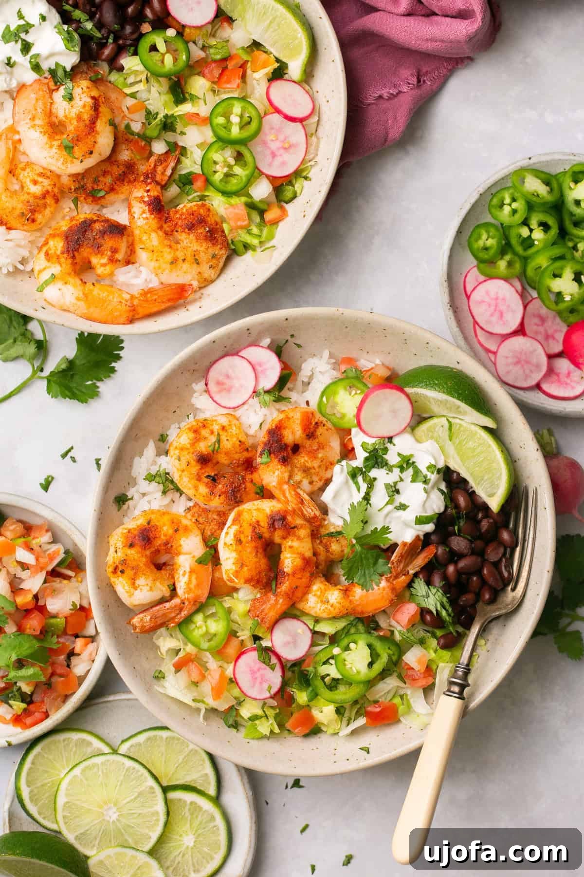 Crispy air fryer shrimp served in a taco bowl with fresh ingredients.