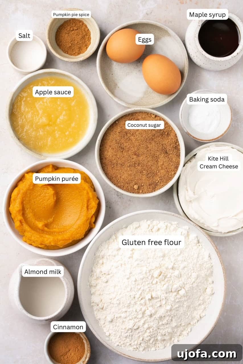 Moist Dairy-Free Pumpkin Muffins with Tangy Cream Cheese Frosting 3 Various gluten-free muffin recipe ingredients neatly arranged in nesting bowls, clearly labeled for easy identification, showcasing fresh quality.