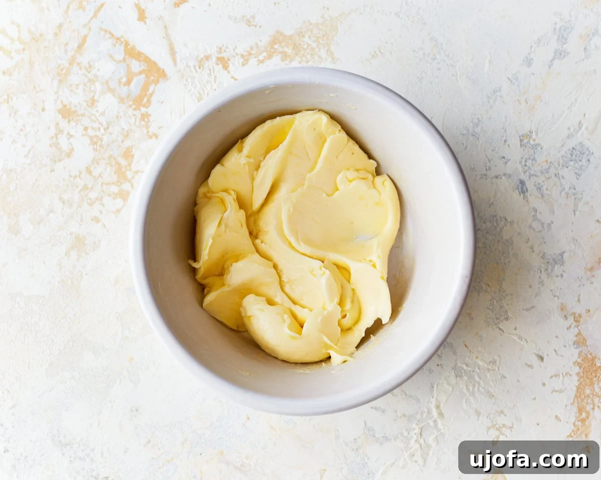 Irresistible Gluten-Free Cinnamon Buns 11 Softened butter in a small white bowl, ready to be mixed for the cinnamon filling.