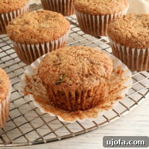 Gluten Free Brunch Delights 28 Freshly baked gluten-free zucchini muffins cooling on a wire rack, showcasing their fluffy texture and golden tops.