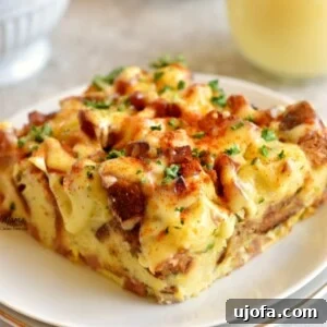 Gluten Free Brunch Delights 46 A perfectly plated serving of gluten-free eggs benedict casserole, showcasing its layers and rich hollandaise, ready to be enjoyed.