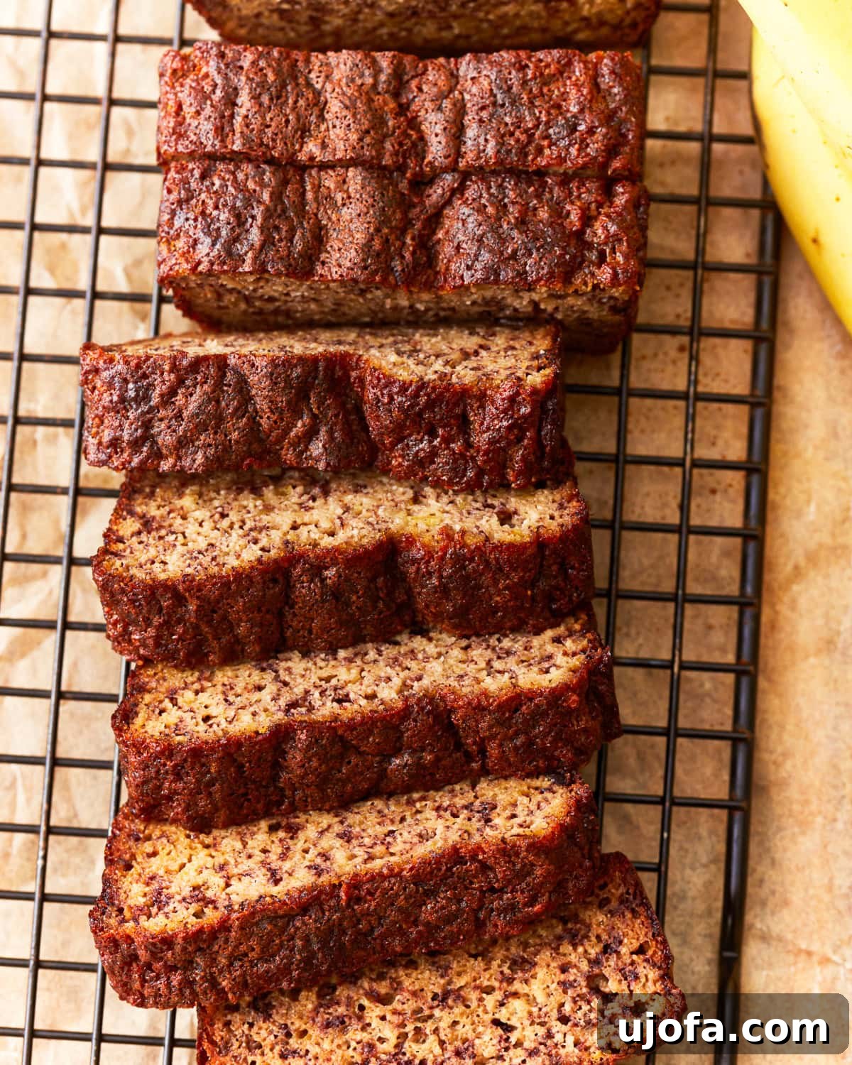 Gluten Free Brunch Delights 49 A beautifully baked coconut flour banana bread loaf, sliced and arranged to show its moist texture and golden-brown crust.