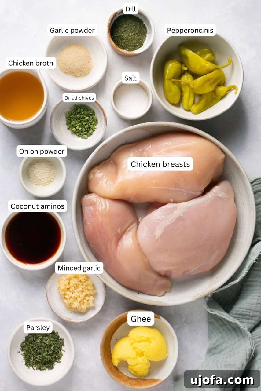 Mississippi Chicken Three Simple Variations 3 A collection of fresh ingredients for Mississippi Chicken arranged in nesting bowls, including chicken breasts, pepperoncini, garlic, and various spices for homemade ranch seasoning.
