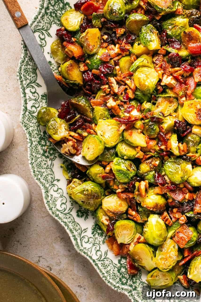 a close up shot of maple bacon brussels sprouts on a serving platter