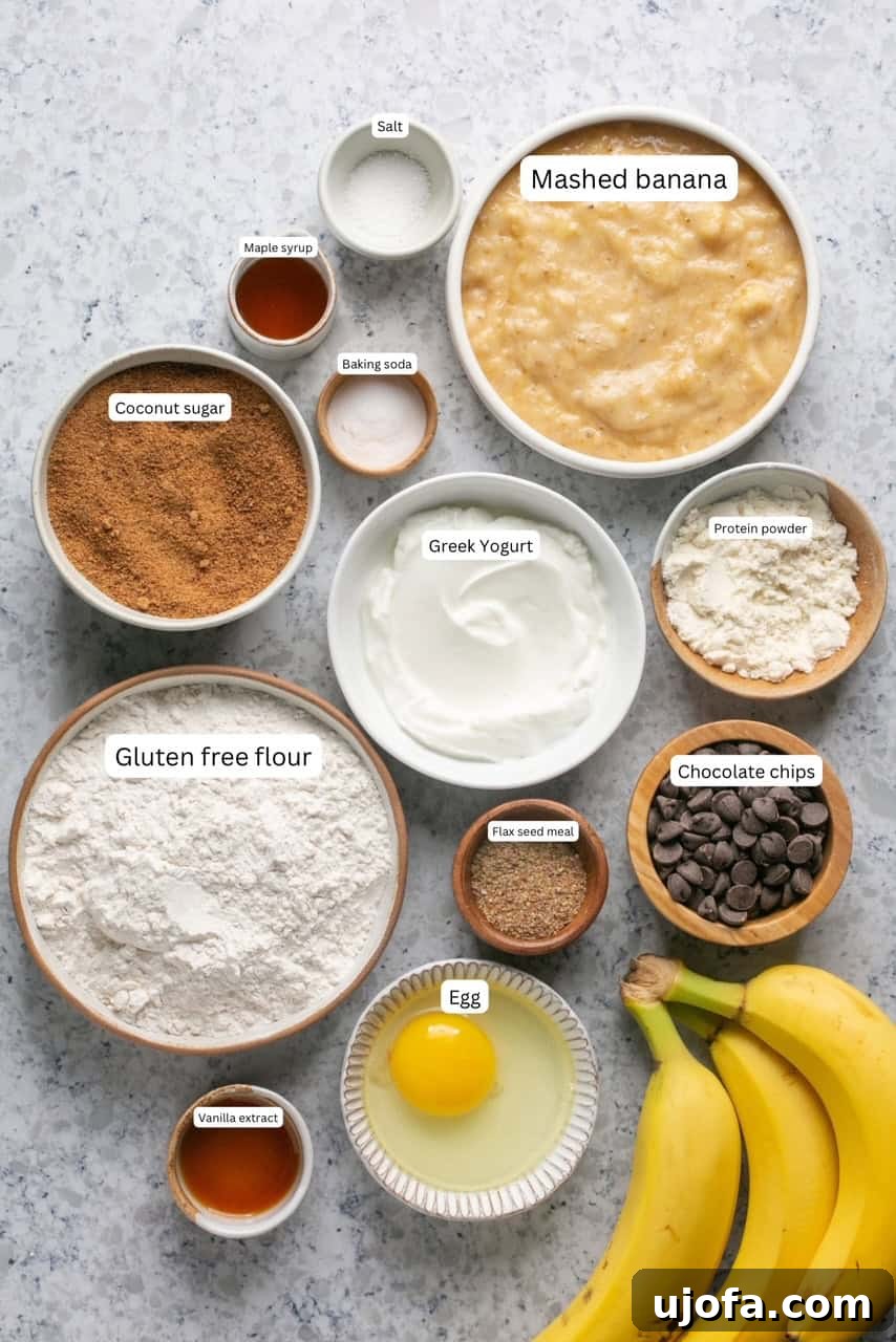 Assorted baking ingredients like flour, sugar, bananas, and chocolate chips, carefully portioned in nesting bowls for healthy banana protein muffins.
