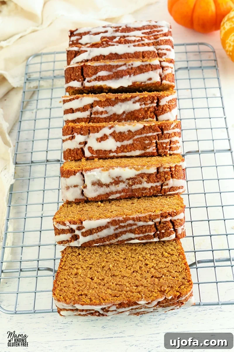 Moist almond flour pumpkin bread cooling on a wire rack, ready to be sliced and enjoyed.