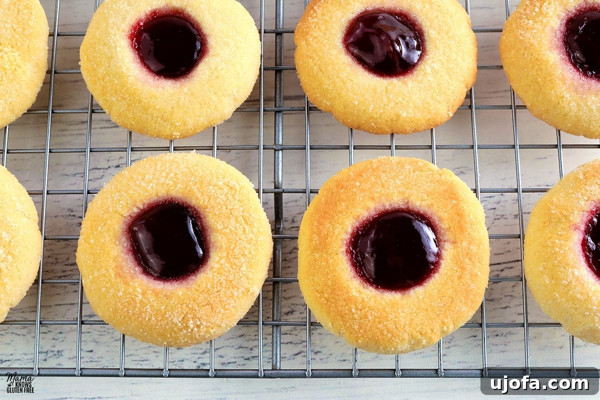 gluten-free thumbprint cookies on a wire cooling rack