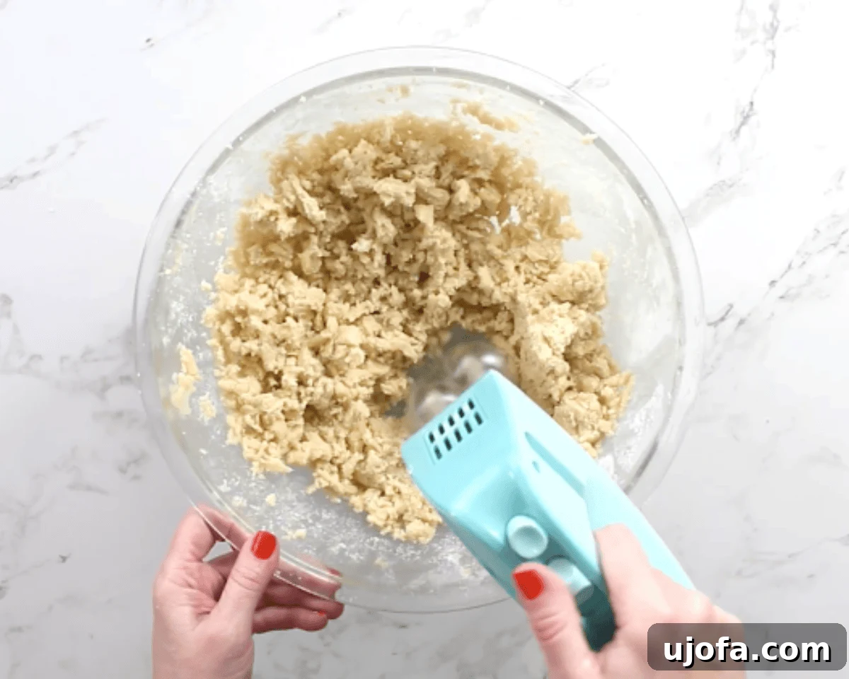 mixing the batter for gluten-free thumbprint cookies