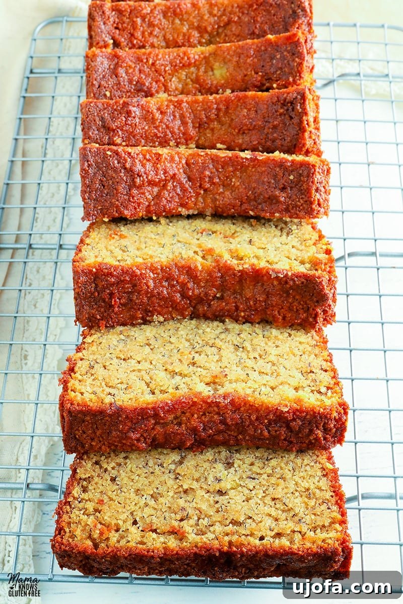Almond flour banana bread sliced on a wire rack, showing its moist interior
