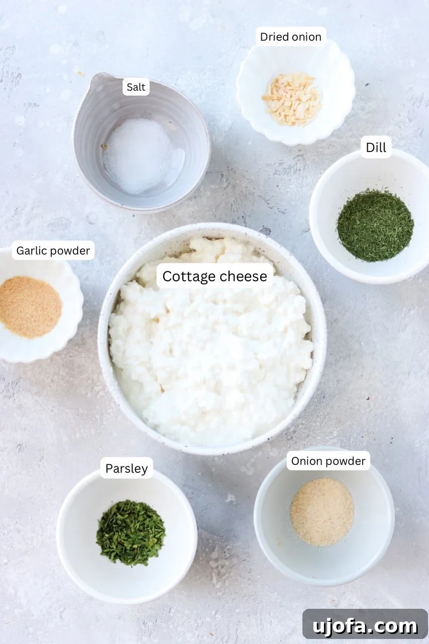 Small bowls containing the individual ingredients for the cottage cheese ranch dip, clearly labeled.