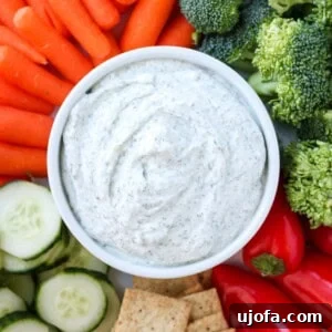 Cottage Cheese Dip in a bowl surrounded by fresh vegetables