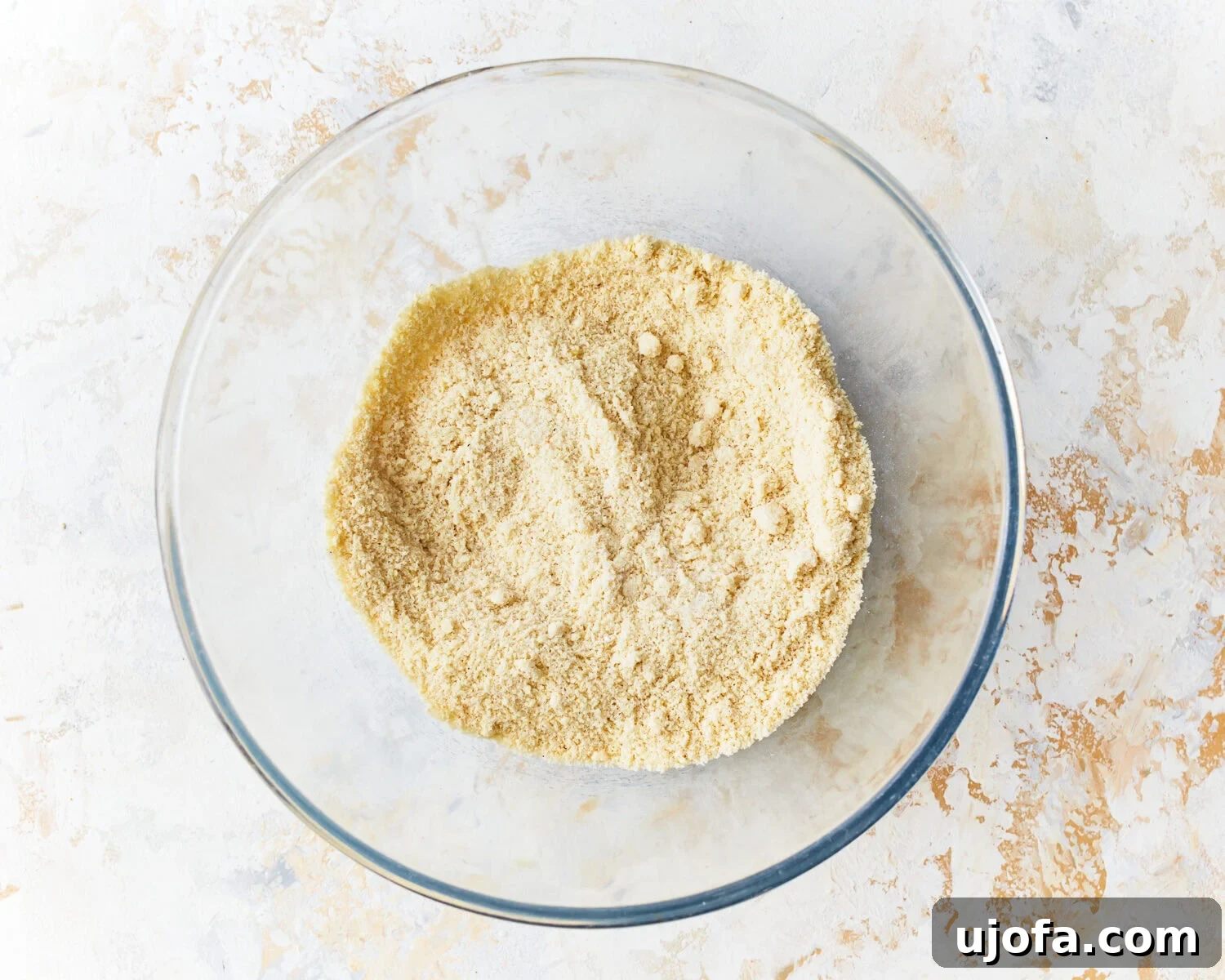 Fluffy Almond Pancakes 5 Dry ingredients for almond flour pancakes in a glass mixing bowl.