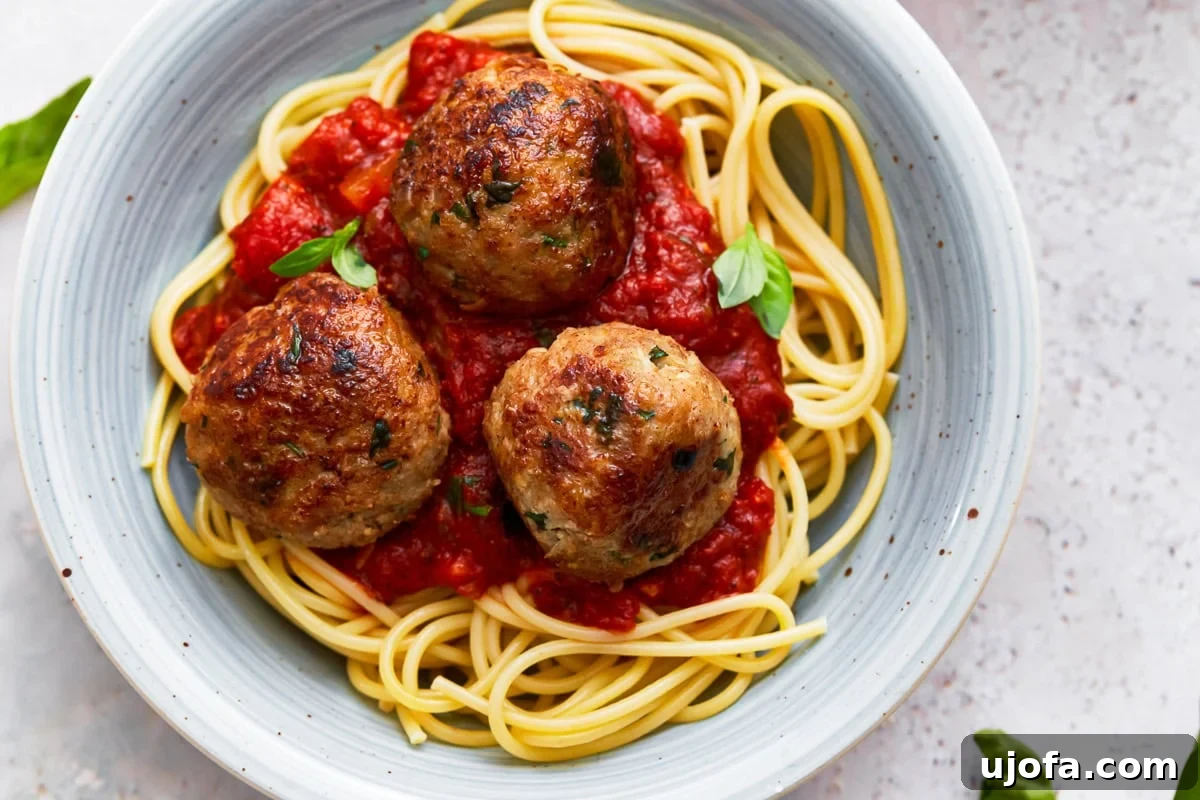 Delicious Gluten-Free Turkey Meatballs 5 A plate of gluten-free meatballs and spaghetti on a plate.
