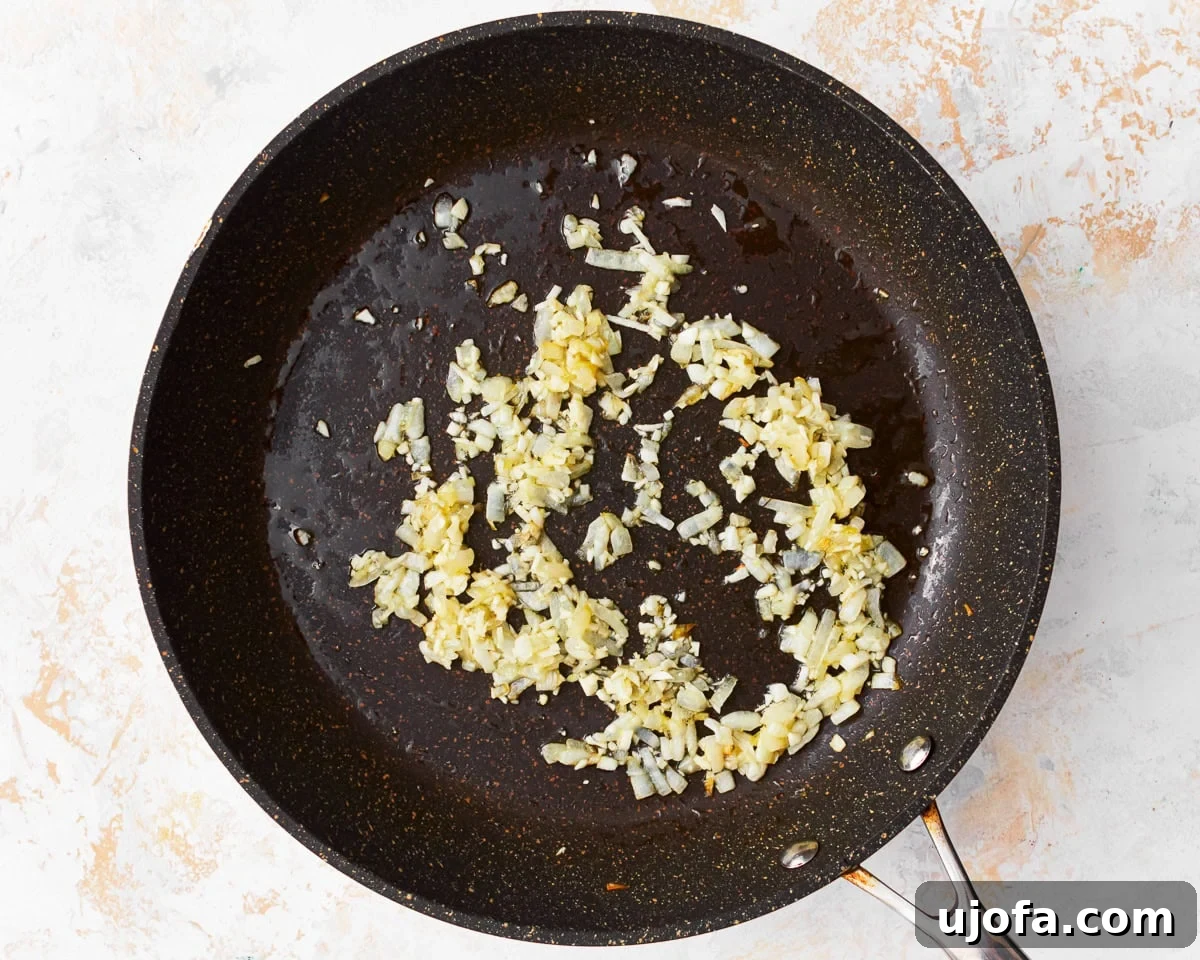 Delicious Gluten-Free Turkey Meatballs 7 Onions and garlic sauteing in a pan