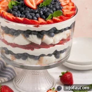 berry angel food trifle with mint in a glass bowl