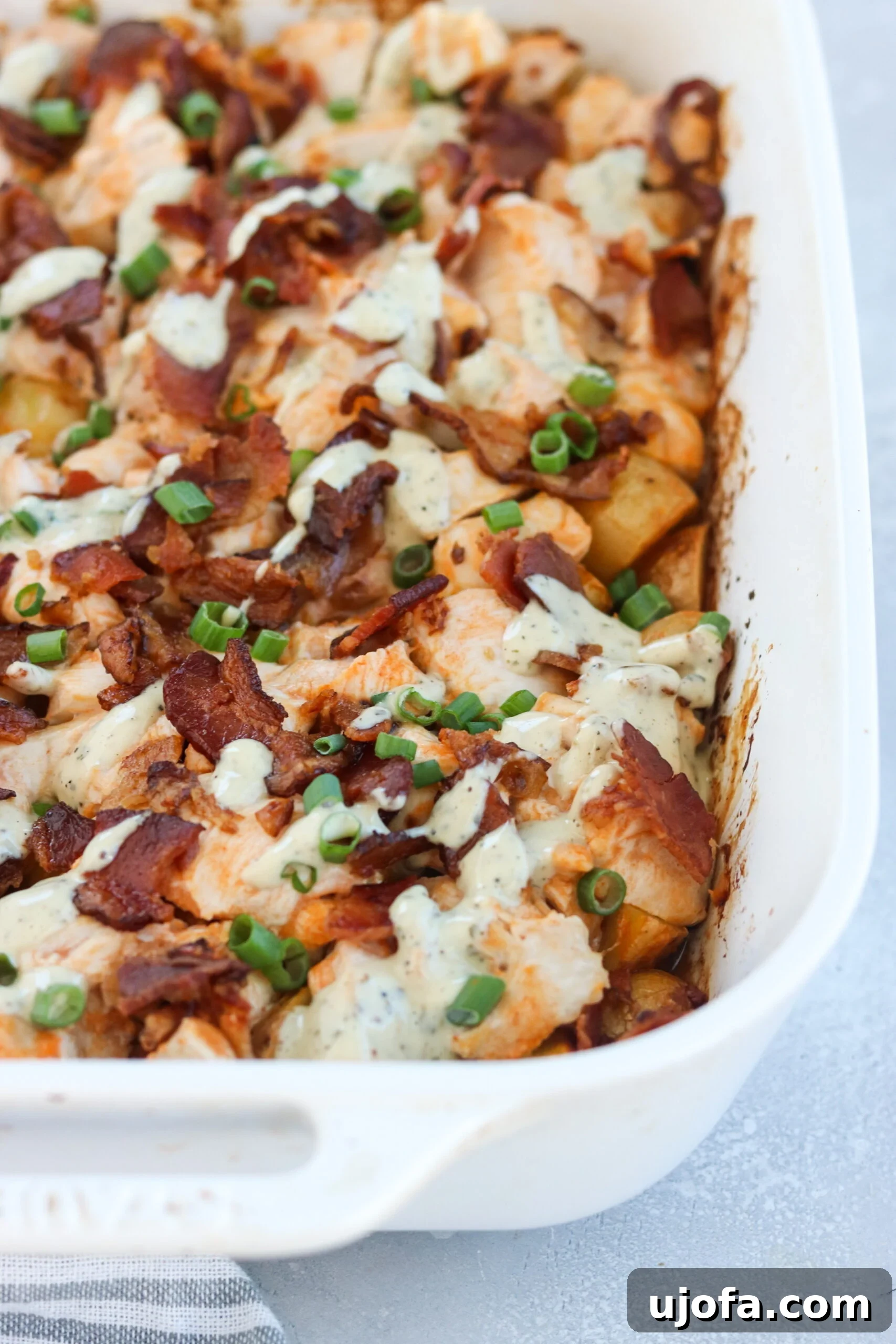 Hearty Whole30 Buffalo Chicken Loaded Potato Casserole 2 A tantalizing Whole30 and Paleo-friendly loaded potato and buffalo chicken casserole, freshly baked and ready to serve.