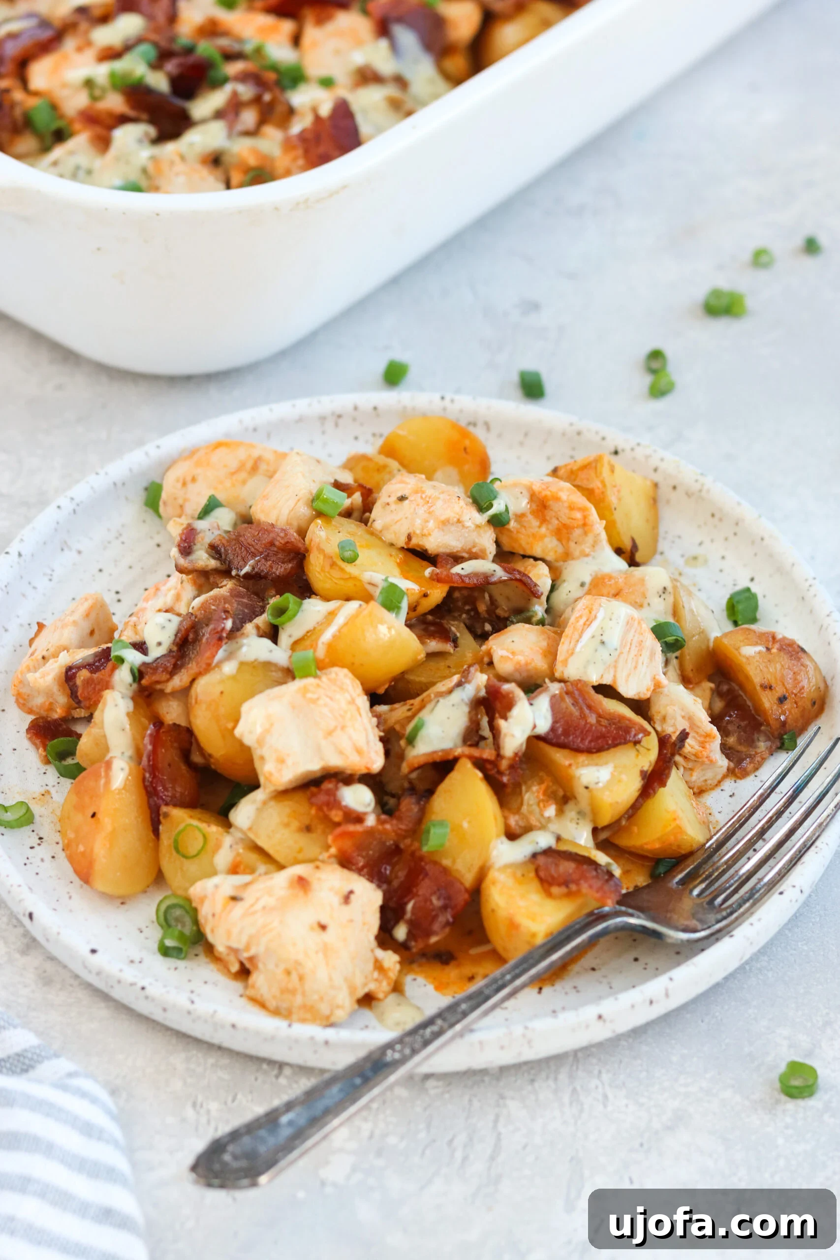Hearty Whole30 Buffalo Chicken Loaded Potato Casserole 5 A large serving of Whole30 Buffalo Chicken Casserole, showcasing the generous portion sizes perfect for a family meal.