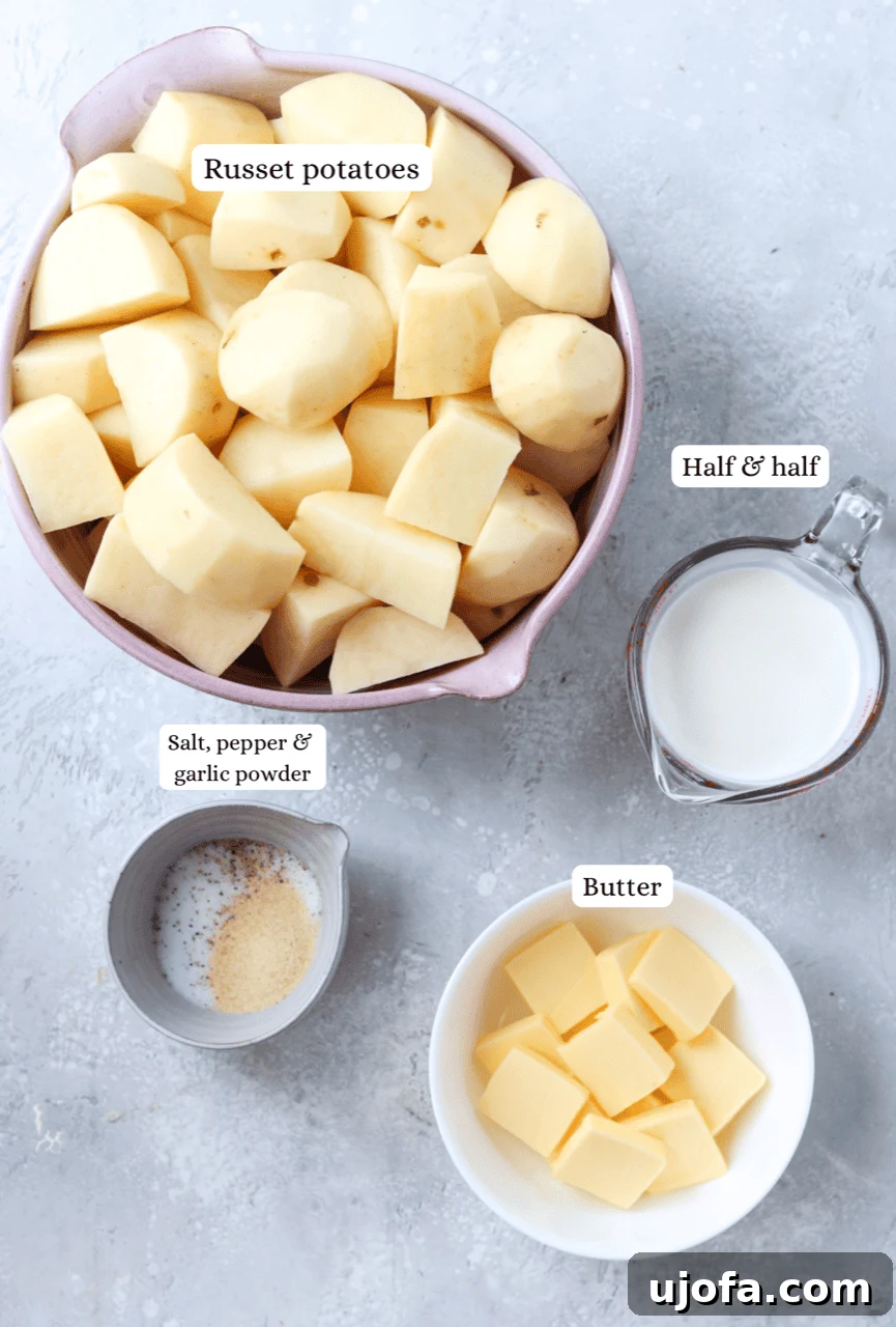 Divine Gluten-Free Mashed Potatoes 3 Nesting bowls displaying key ingredients for gluten-free mashed potatoes: peeled russet potatoes, butter, half & half, salt, pepper, and garlic powder