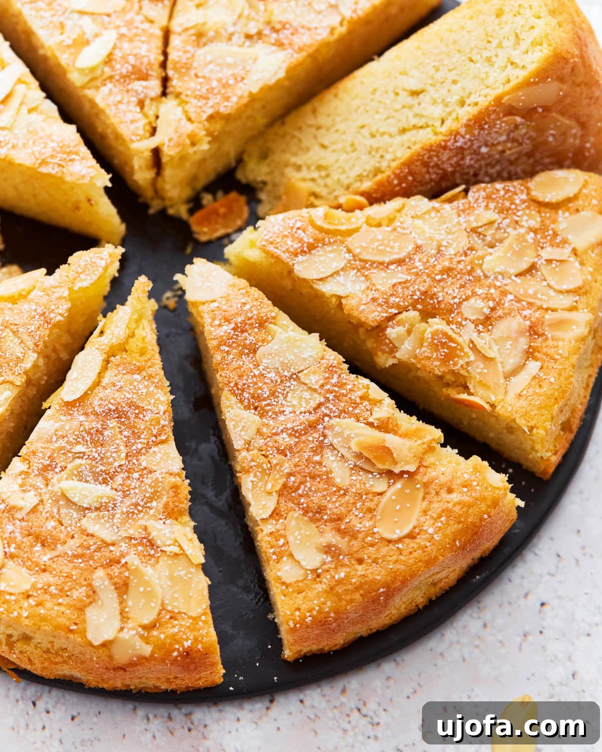 Tender Almond Flour Cake 2 Almond flour cake cut into slices, showing its moist and tender crumb.