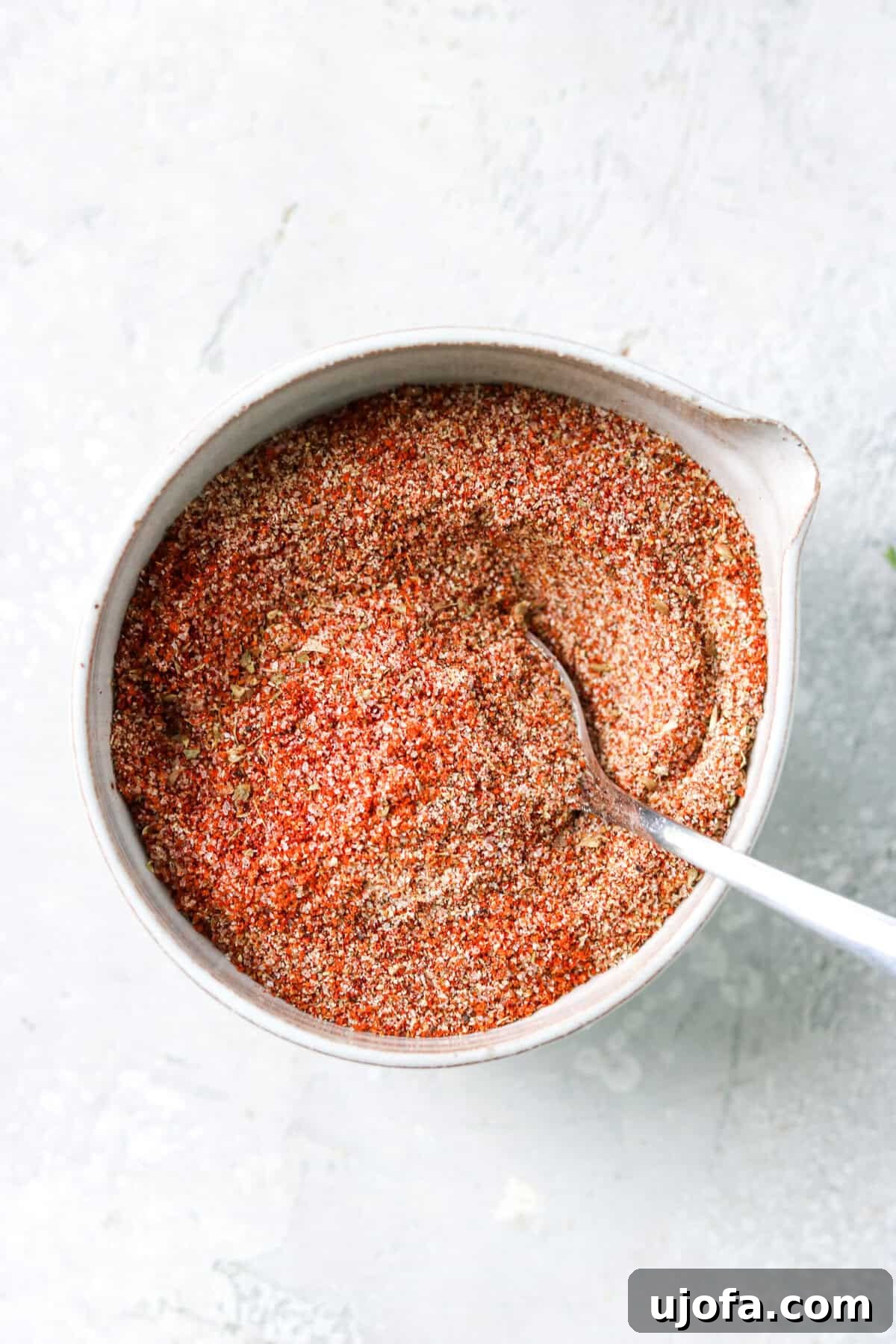 Fiesta Chicken Taco Blend 4 Homemade chicken taco seasoning in a small bowl with a measuring spoon.
