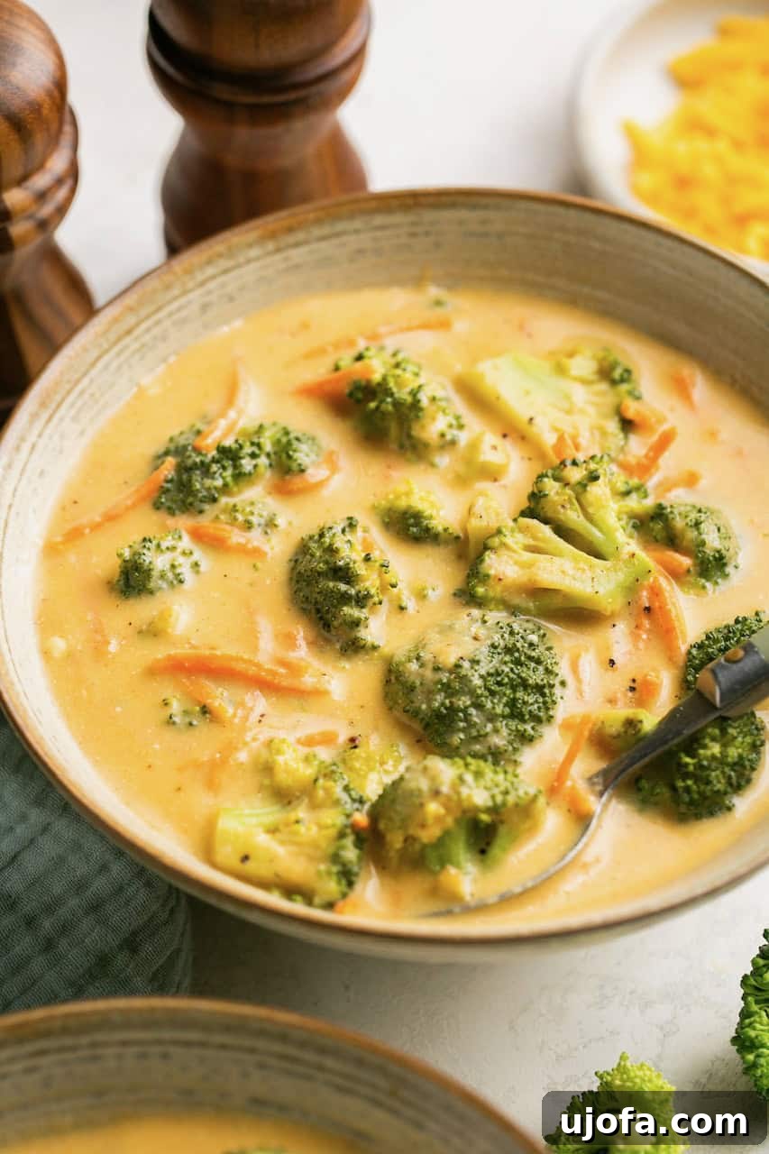 Creamy Instant Pot Broccoli Cheddar Soup 8 Instant Pot broccoli cheddar soup in a bowl with salt and pepper shakers behind it