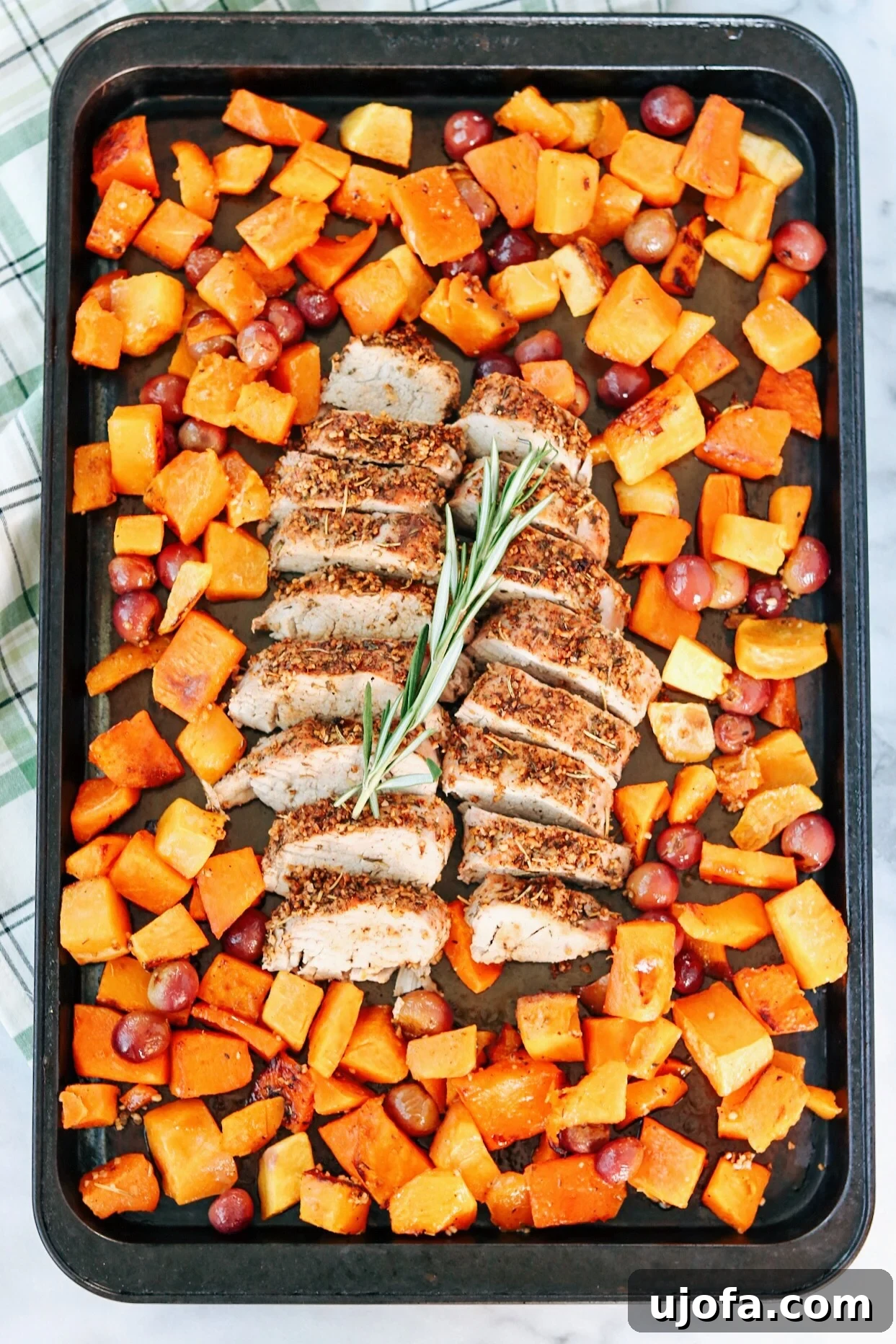 Close-up of roasted butternut squash and red grapes