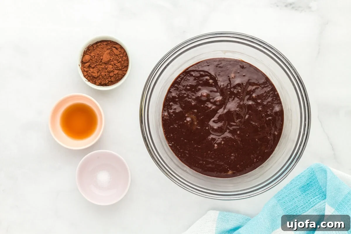 Fudgy Flourless Delights 8 Flourless brownie batter in a glass mixing bowl.