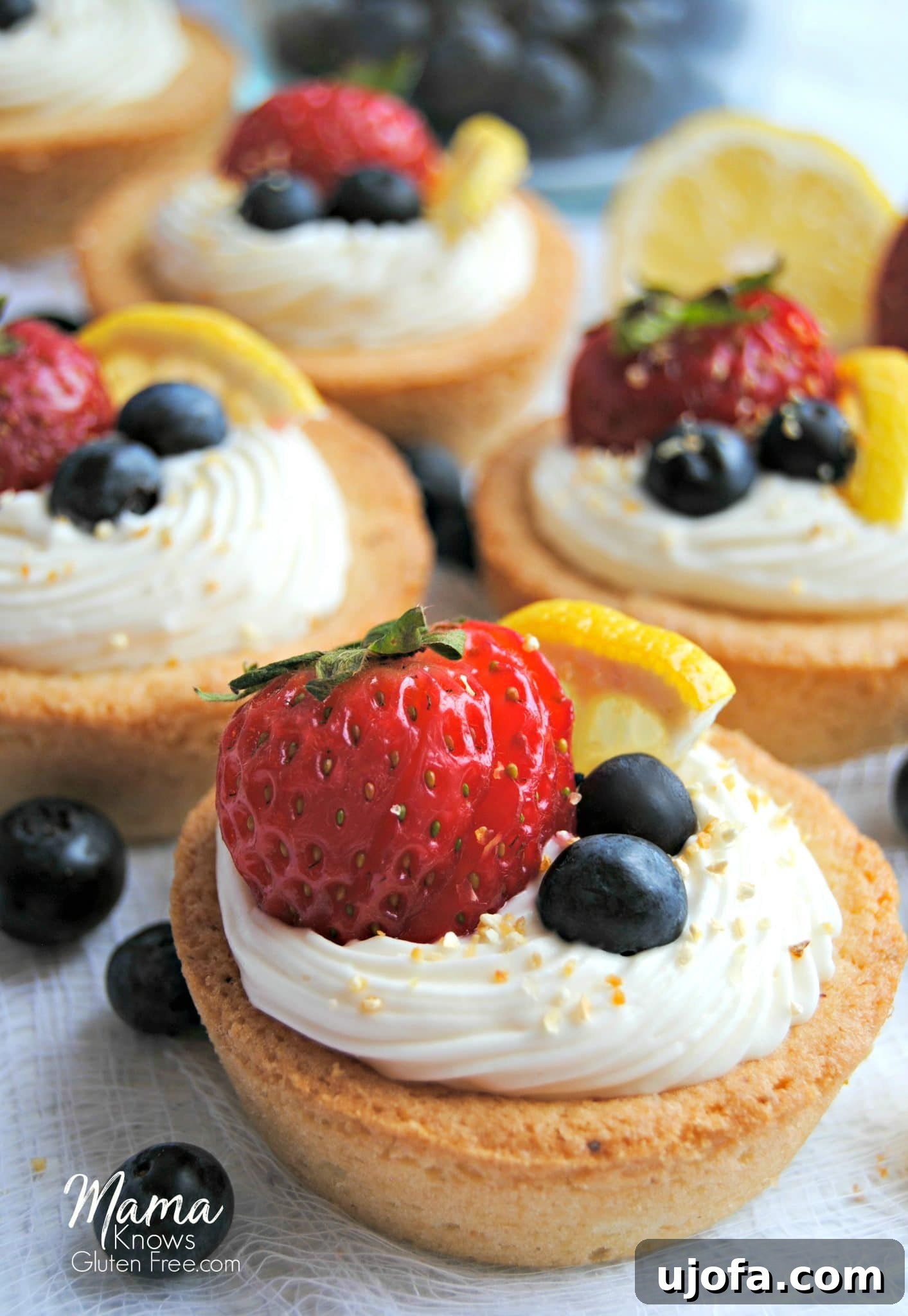 Gluten-Free Cheesecake Stuffed Sugar Cookie Cups 2 Gluten-Free Cheesecake Sugar Cookie Cups topped with fresh berries