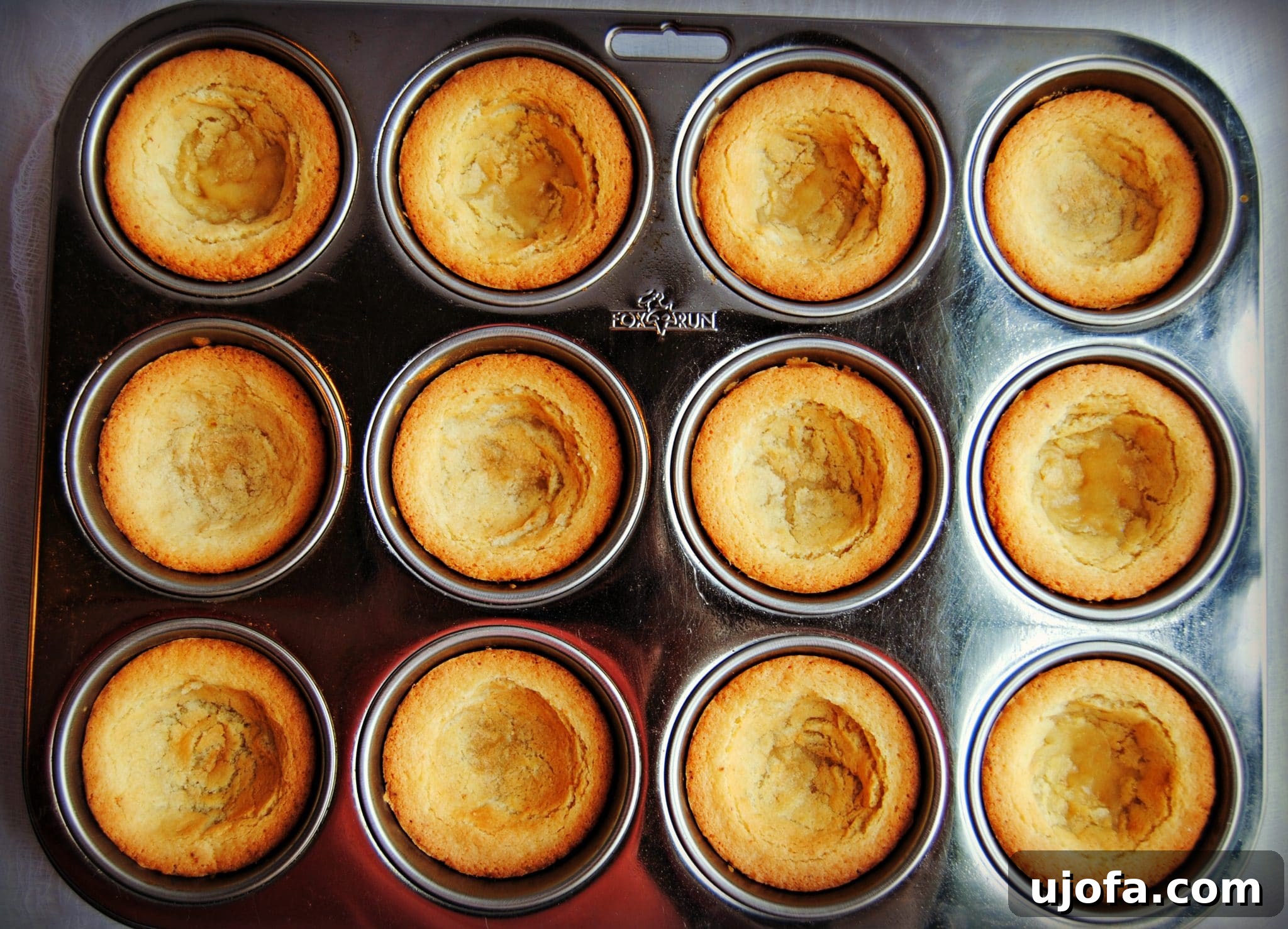 Gluten-Free Cheesecake Stuffed Sugar Cookie Cups 3 Gluten-Free Sugar Cookie Cups ready for cheesecake filling