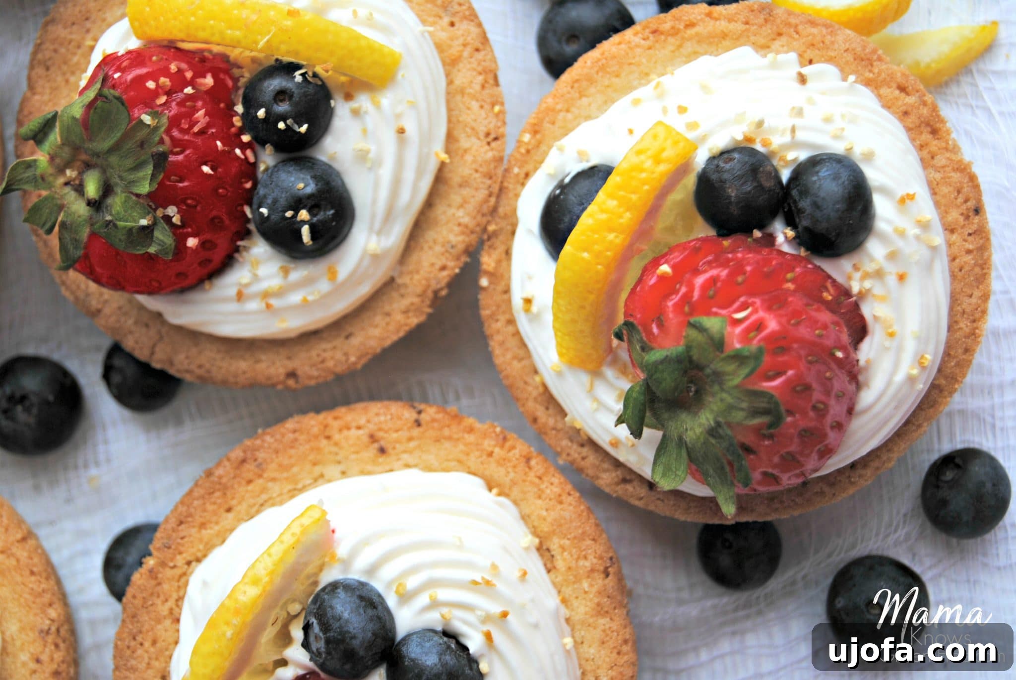 Gluten-Free Cheesecake Stuffed Sugar Cookie Cups 4 Gluten-Free Cheesecake Sugar Cookie Cups with various fruit toppings