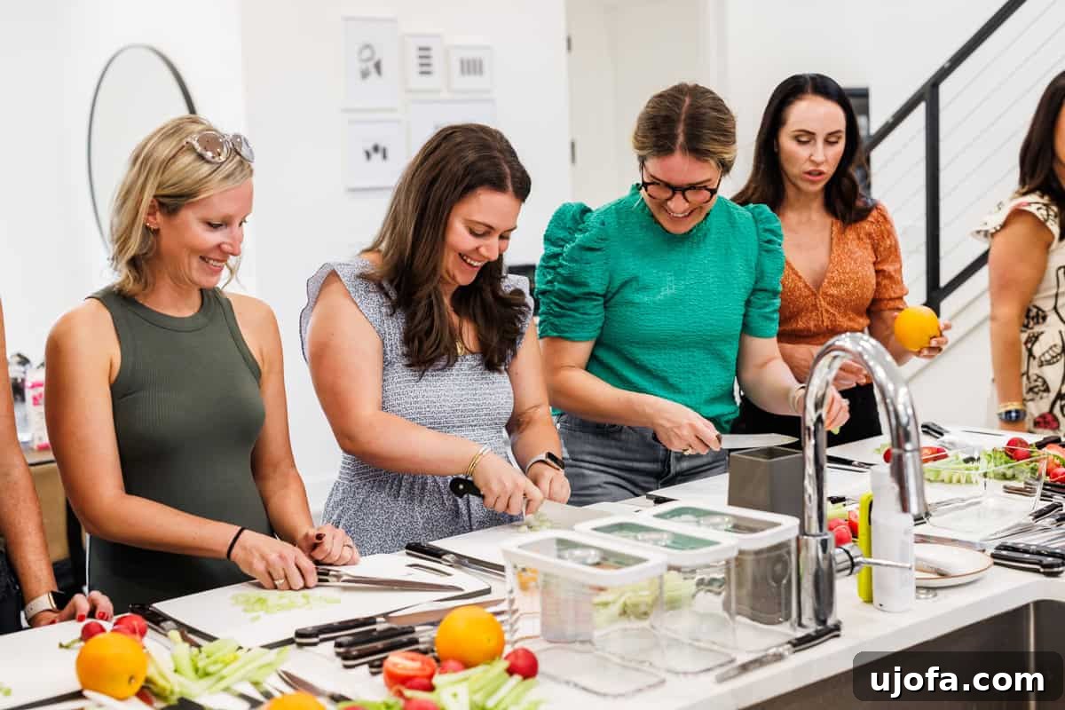 Plant-Based Eggnog 4 Bloggers engaged in a focused knife skills class taught by an expert chef from Zwilling at the Fresh Air Retreat Austin.