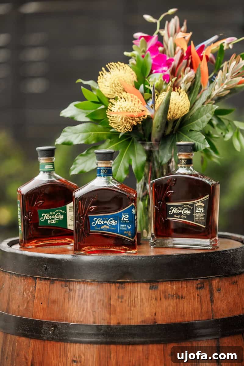 Plant-Based Eggnog 7 A collection of premium Flor de Caña rums displayed elegantly on a wooden barrel, highlighting their rich heritage.