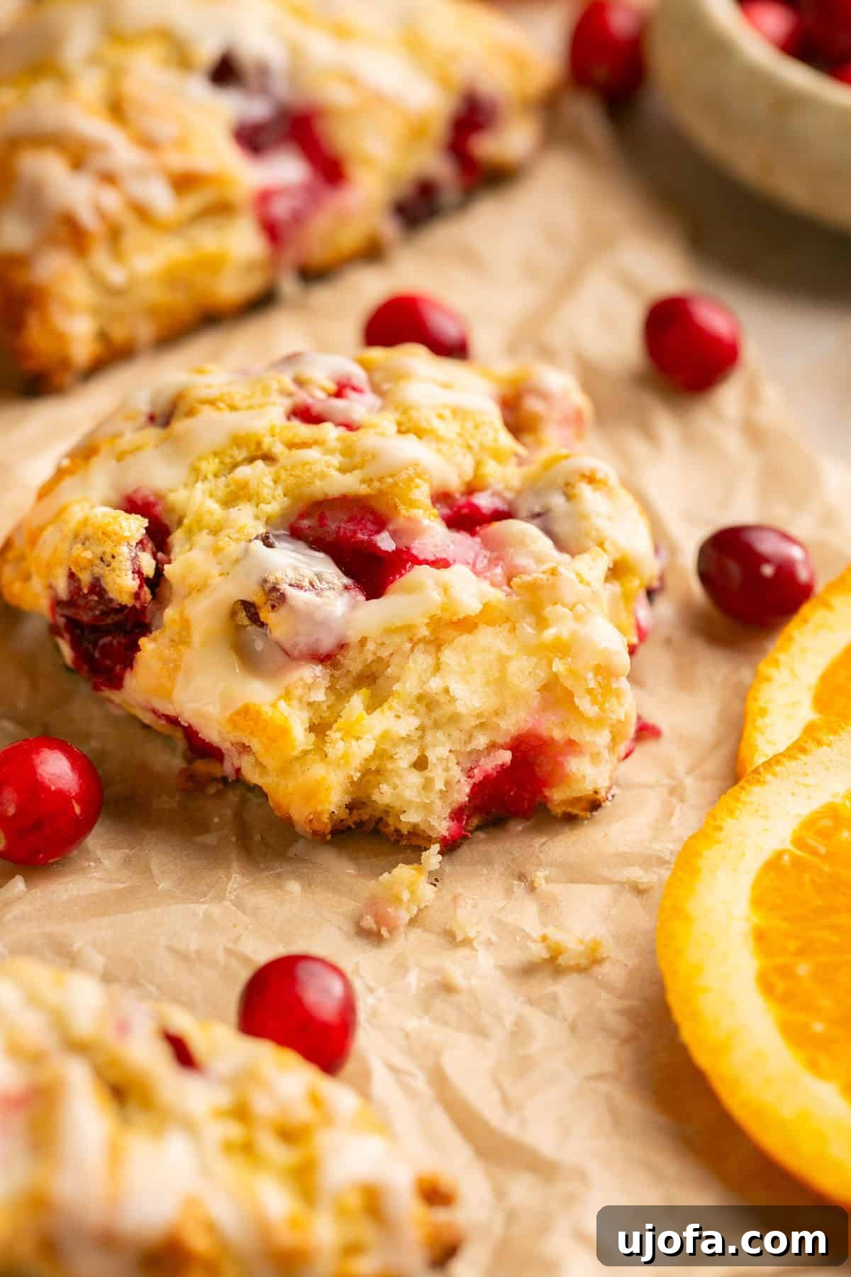 A Cranberry Orange Gluten Free Scone with a Bite Taken Out
