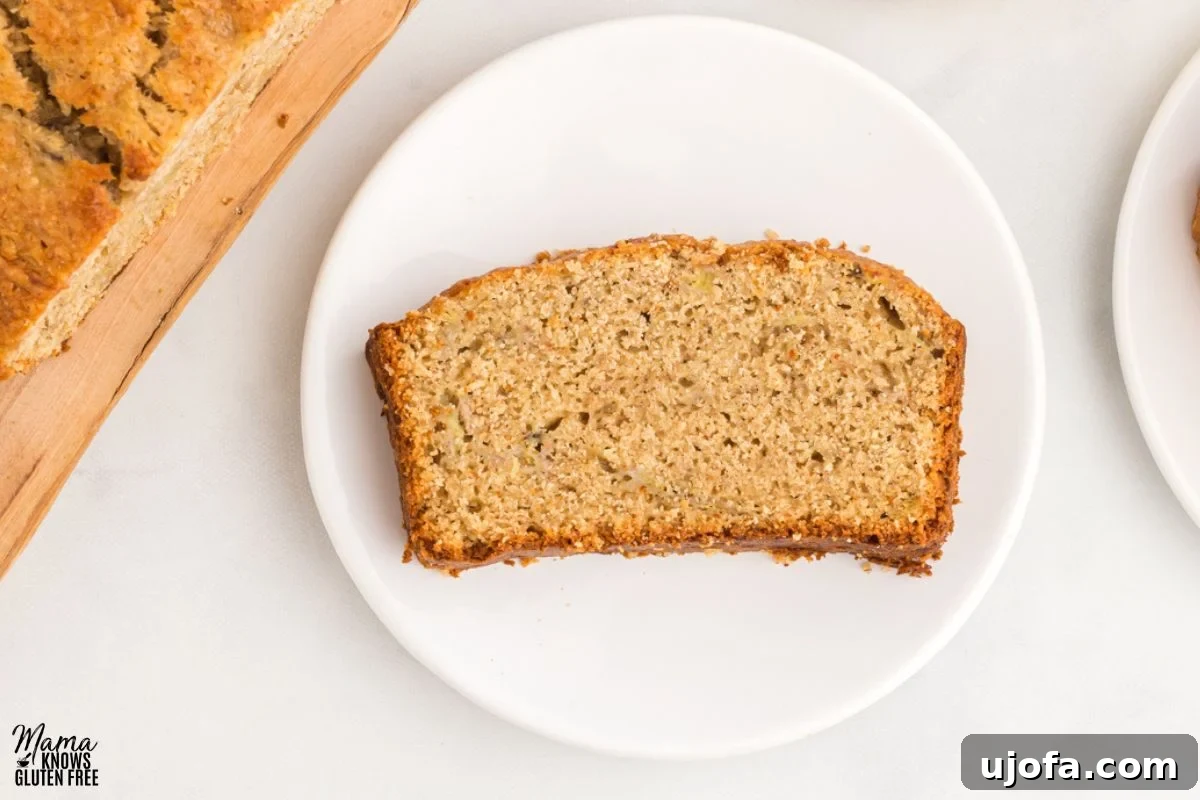 Slice of Oat Flour Banana Bread on white plate.