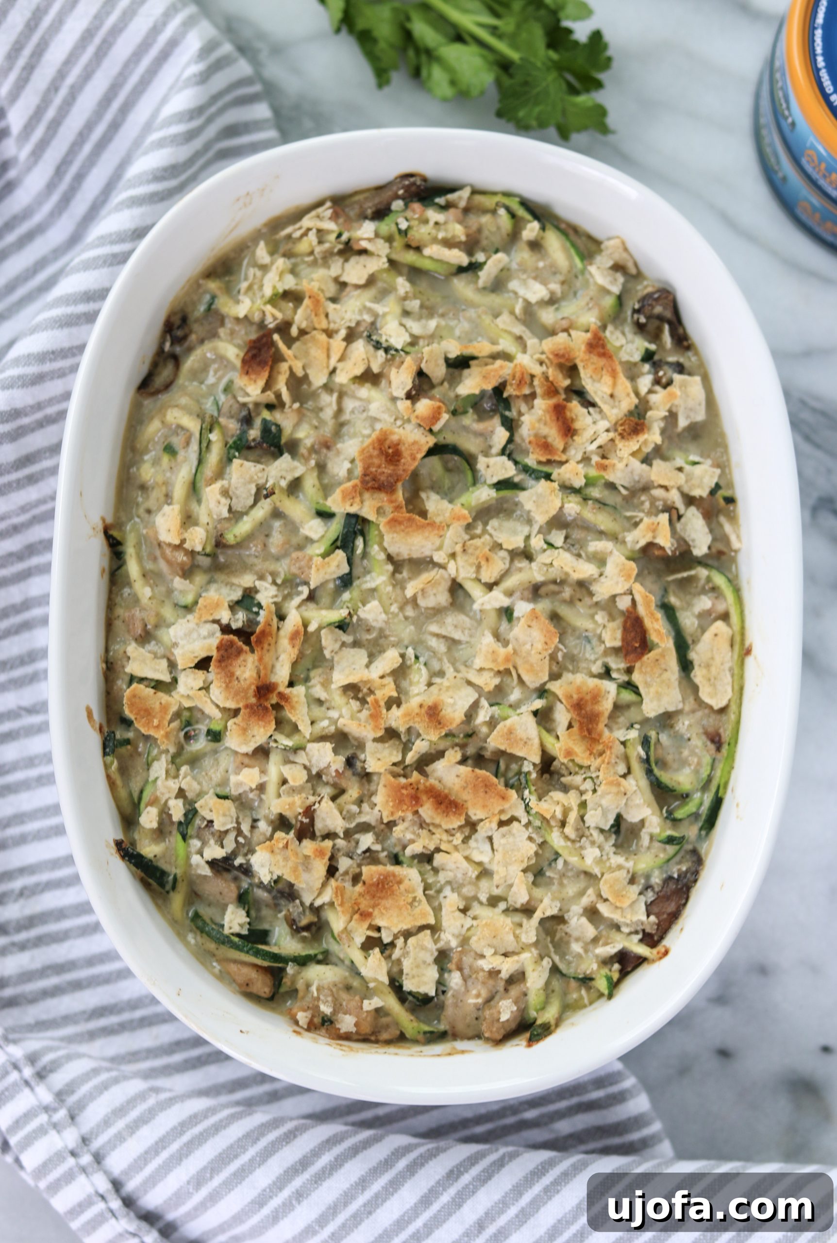 Close-up of Tuna Zoodle Casserole with a creamy sauce and mushrooms