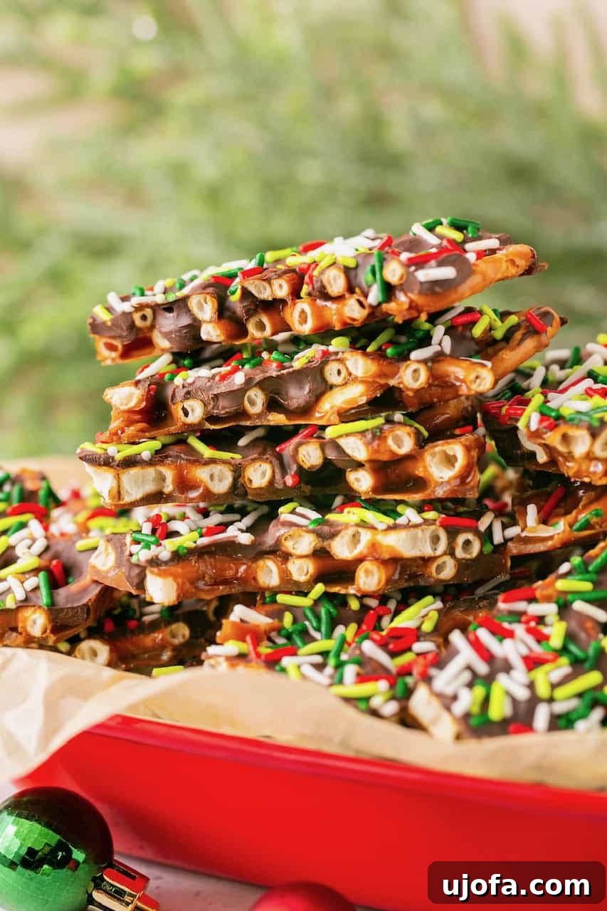 Stack of Gluten-Free Pretzel Christmas Crack pieces on parchment paper