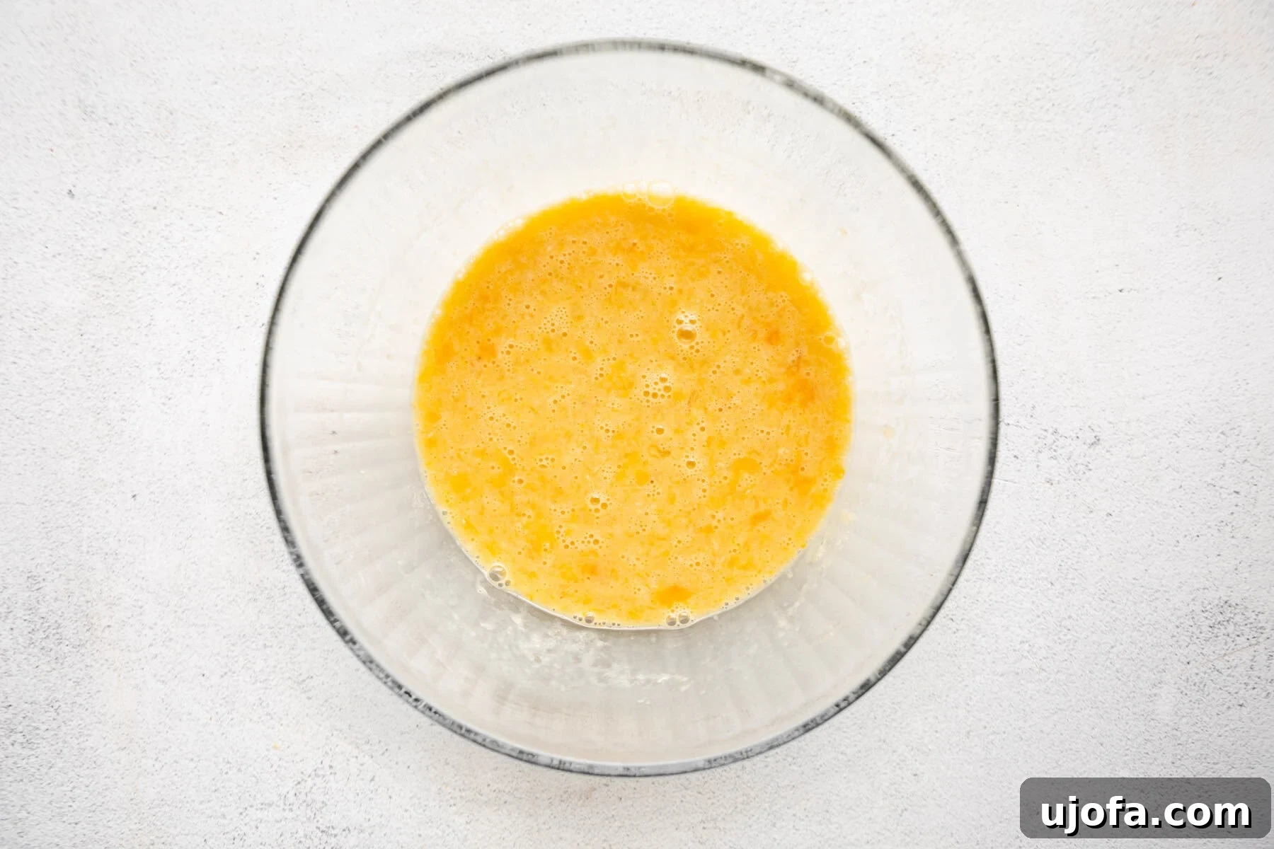 Almond Cloud Waffles 7 Wet ingredients for almond flour waffles in a glass mixing bowl